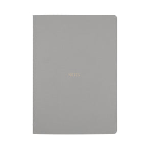 A5 SIZE NOTEBOOK NOTES FOILED COVER DETAIL, CARDBOARD COVER COLOR SMOKE GREY, INTERIOR DOTTED, ROUNDED CORNERS, VISIBLE SINGER STITCHING ON THE SPINE, INTERIOR PAPER IVORY-COLORED 90 GMS, ACID FREE PAPER MADE IN COLOMBIA BY MAKE2D