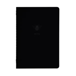 A5 SIZE NOTEBOOK BEE NOTES MATE FOILED COVER DETAIL, CARDBOARD COVER COLOR BLACK, INTERIOR DOTTED, ROUNDED CORNERS, VISIBLE SINGER STITCHING ON THE SPINE, INTERIOR PAPER IVORY-COLORED 90 GMS, ACID FREE PAPER MADE IN COLOMBIA BY MAKE2D