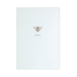 A5 SIZE NOTEBOOK GOLD FOILED COVER DETAIL BEE NOTES, CARDBOARD COVER COLOR WHITE, INTERIOR DOTTED OR RULED, ROUNDED CORNERS, VISIBLE SINGER STITCHING ON THE SPINE, INTERIOR PAPER IVORY-COLORED 90 GMS, ACID FREE PAPER BY MAKE2D