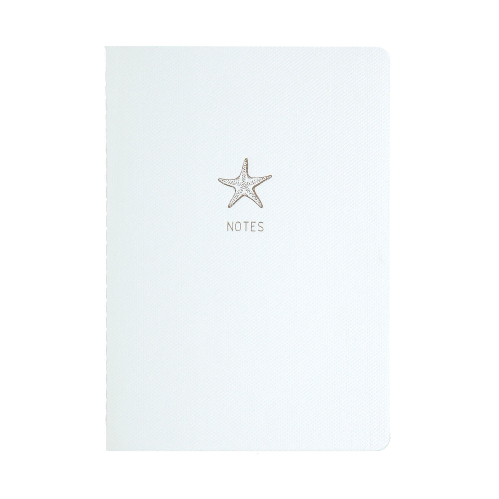 A5 SIZE NOTEBOOK STARFISH NOTES GOLD FOILED COVER DETAIL, CARDBOARD COVER COLOR WHITE, INTERIOR DOTTED, ROUNDED CORNERS, VISIBLE SINGER STITCHING ON THE SPINE, INTERIOR PAPER IVORY-COLORED 90 GMS, ACID FREE PAPER MADE IN COLOMBIA BY MAKE2D