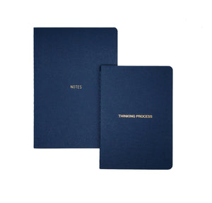 A5 NOTEBOOK B6 THINKING PROCESS  GOLD FOILED COVER DETAIL, CARDBOARD COVER COLOR BLUE, INTERIOR DOTTED OR RULED, ROUNDED CORNERS, VISIBLE SINGER STITCHING ON THE SPINE, INTERIOR PAPER IVORY-COLORED 90 GMS, ACID FREE PAPER MADE IN COLOMBIA BY MAKE2D