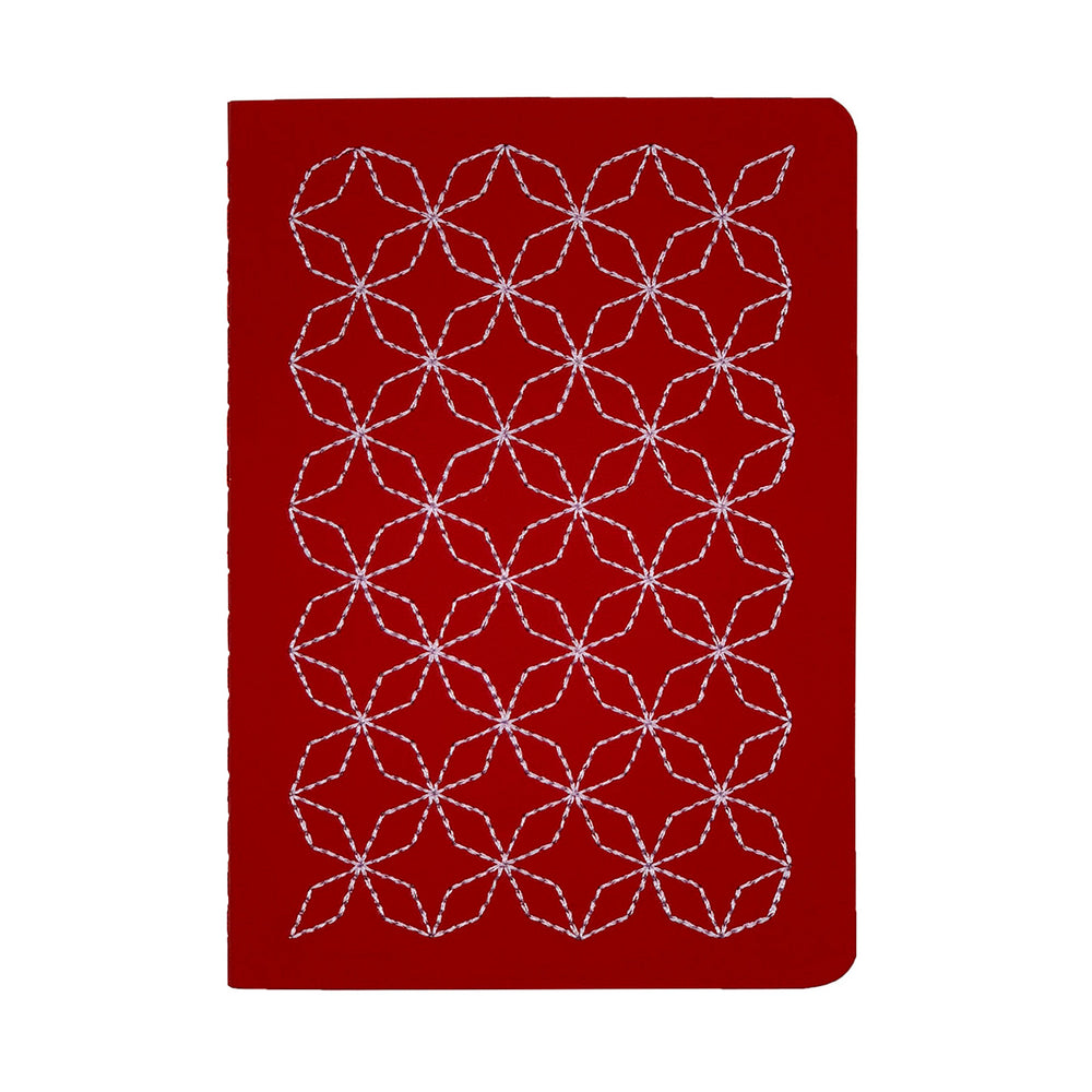 A5  SIZE NOTEBOOK EMBOROIDERED TOKYO COVER DETAIL, CARDBOARD COVER COLOR RED, LILAC EMBROIDERY, INTERIOR DOTTED OR RULED, ROUNDED CORNERS, VISIBLE SINGER STITCHING ON THE SPINE, INTERIOR PAPER IVORY-COLORED 90 GMS, ACID FREE PAPER BACK GOLD FOIL COVER DETAIL MADE IN COLOMBIA BY MAKE2D