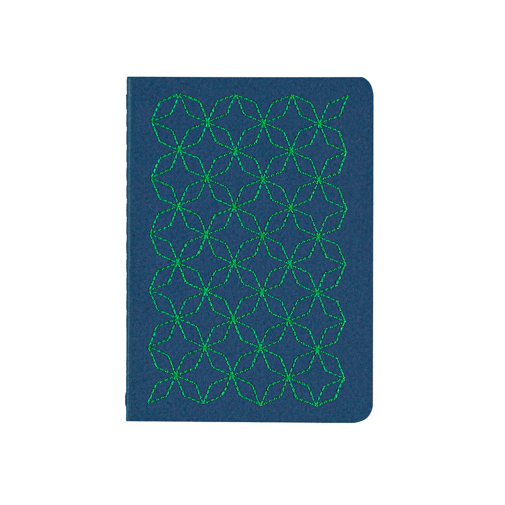 A6 POCKET SIZE NOTEBOOK EMBOROIDERED TOKYO COVER DETAIL, CARDBOARD COVER COLOR BLUE, GREEN EMBROIDERY, INTERIOR DOTTED OR RULED, ROUNDED CORNERS, VISIBLE SINGER STITCHING ON THE SPINE, INTERIOR PAPER IVORY-COLORED 90 GMS, ACID FREE PAPER BACK GOLD FOIL COVER DETAIL MADE IN COLOMBIA BY MAKE2D