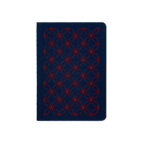 A6 POCKET SIZE NOTEBOOK EMBOROIDERED TOKYO COVER DETAIL, CARDBOARD COVER COLOR BLUE, RED EMBROIDERY, INTERIOR DOTTED OR RULED, ROUNDED CORNERS, VISIBLE SINGER STITCHING ON THE SPINE, INTERIOR PAPER IVORY-COLORED 90 GMS, ACID FREE PAPER BACK GOLD FOIL COVER DETAIL MADE IN COLOMBIA BY MAKE2D