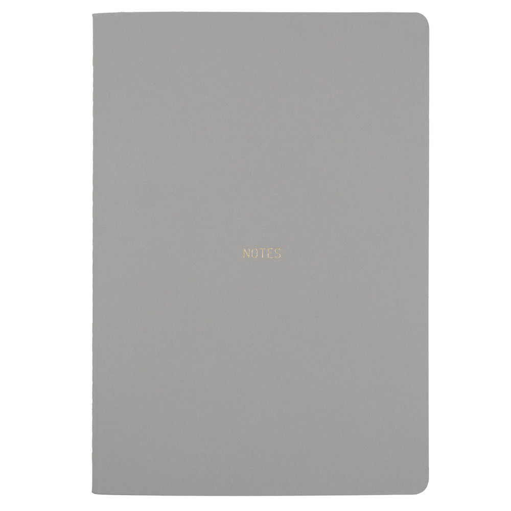 B5 SIZE NOTEBOOK NOTES GOLD FOILED COVER DETAIL, CARDBOARD COVER COLOR SMOKE GREY INTERIOR DOTTED OR RULED, ROUNDED CORNERS, VISIBLE SINGER STITCHING ON THE SPINE, INTERIOR PAPER IVORY-COLORED 90 GMS, ACID FREE PAPER MADE IN COLOMBIA BY MAKE2D