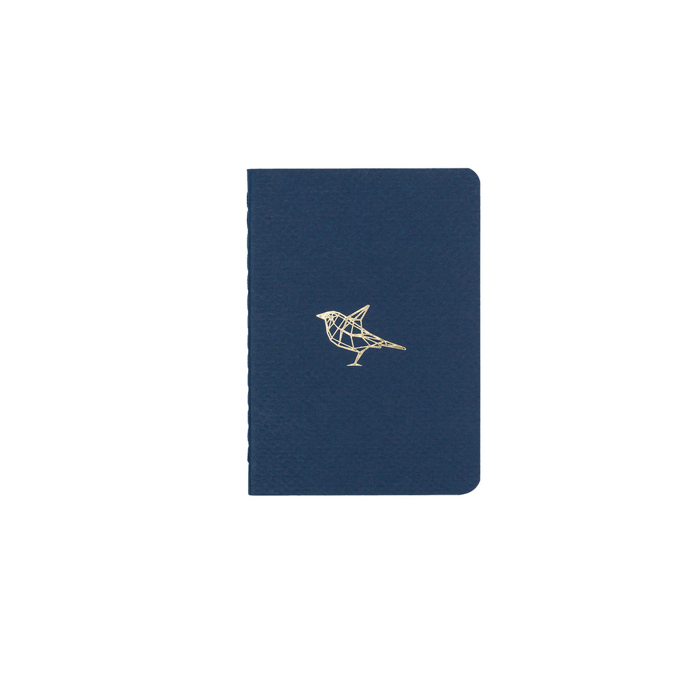 B7 MINI POCKET SIZE NOTEBOOK BIRD GOLD FOILED COVER DETAIL, CARDBOARD COVER COLOR BLUE, INTERIOR DOTTED, ROUNDED CORNERS, VISIBLE SINGER STITCHING ON THE SPINE, INTERIOR PAPER IVORY-COLORED 90 GMS, ACID FREE PAPER MADE IN COLOMBIA BY MAKE2D