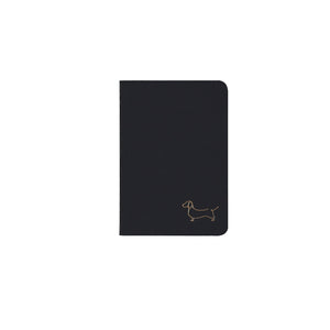 B7 MINI POCKET SIZE NOTEBOOK DACHSHUND GOLD FOILED COVER DETAIL, CARDBOARD COVER COLOR BLACK, INTERIOR DOTTED, ROUNDED CORNERS, VISIBLE SINGER STITCHING ON THE SPINE, INTERIOR PAPER IVORY-COLORED 90 GMS, ACID FREE PAPER MADE IN COLOMBIA BY MAKE2D