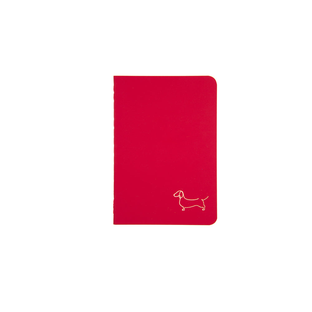 B7 MINI POCKET SIZE NOTEBOOK DACHSHUND GOLD FOILED COVER DETAIL, CARDBOARD COVER COLOR RED, INTERIOR DOTTED, ROUNDED CORNERS, VISIBLE SINGER STITCHING ON THE SPINE, INTERIOR PAPER IVORY-COLORED 90 GMS, ACID FREE PAPER MADE IN COLOMBIA BY MAKE2D