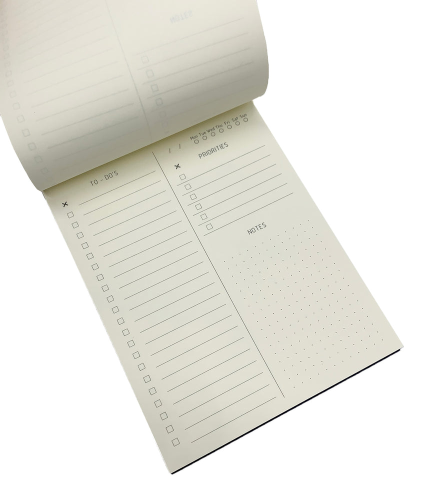 TO-DO LIST NOTEPAD GOLD FOILED COVER DETAIL, CARDBOARD COVER COLOR BLUE, TO-DO’S. PRIORITIES INTERIOR PAPER IVORY-COLORED 90 GMS, ACID FREE PAPER, GOLD SCREWS WITH PRE-PERFORATED DETACHABLE SHEETS MADE IN COLOMBIA BY MAKE2D