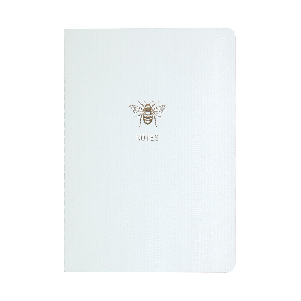 
                
                    Load image into Gallery viewer, A5 SIZE NOTEBOOK GOLD FOILED COVER DETAIL BEE NOTES, CARDBOARD COVER COLOR WHITE, INTERIOR DOTTED OR RULED, ROUNDED CORNERS, VISIBLE SINGER STITCHING ON THE SPINE, INTERIOR PAPER IVORY-COLORED 90 GMS, ACID FREE PAPER BY MAKE2D
                
            