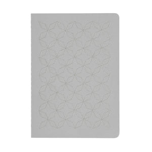 A5  SIZE NOTEBOOK EMBOROIDERED TOKYO COVER DETAIL, CARDBOARD COVER COLOR GREY, SMOKE GREY EMBROIDERY, INTERIOR DOTTED OR RULED, ROUNDED CORNERS, VISIBLE SINGER STITCHING ON THE SPINE, INTERIOR PAPER IVORY-COLORED 90 GMS, ACID FREE PAPER BACK GOLD FOIL COVER DETAIL MADE IN COLOMBIA BY MAKE2D