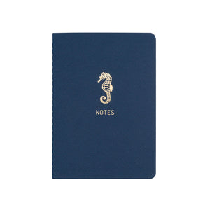 A6 POCKET SIZE NOTEBOOK SEAHORSE NOTES GOLD FOILED COVER DETAIL, CARDBOARD COVER COLOR BLUE, INTERIOR DOTTED OR RULED, ROUNDED CORNERS, VISIBLE SINGER STITCHING ON THE SPINE, INTERIOR PAPER IVORY-COLORED 90 GMS, ACID FREE PAPER MADE IN COLOMBIA BY MAKE2D