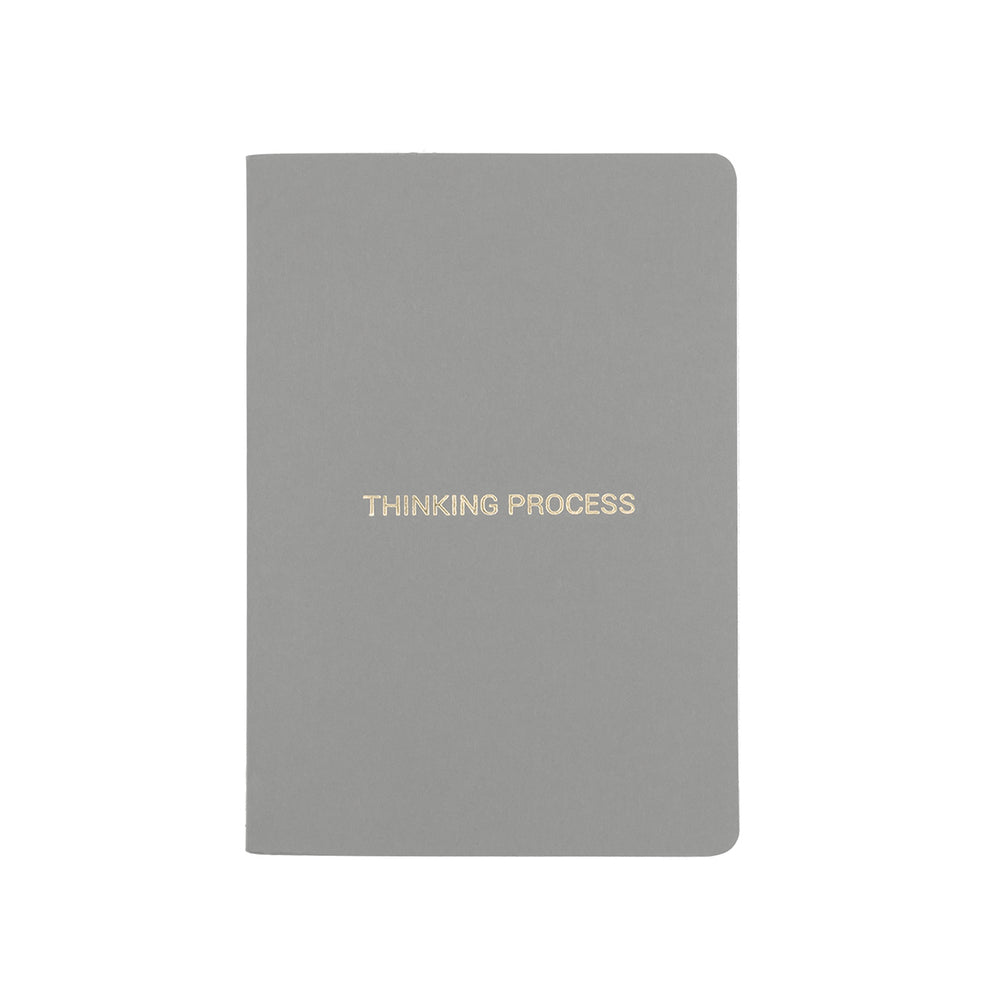 A6 POCKET SIZE NOTEBOOK THINKING PROCESS GOLD FOILED COVER DETAIL, CARDBOARD COVER COLOR GREY, INTERIOR DOTTED OR RULED, ROUNDED CORNERS, VISIBLE SINGER STITCHING ON THE SPINE, INTERIOR PAPER IVORY-COLORED 90 GMS, ACID FREE PAPER MADE IN COLOMBIA BY MAKE2D
