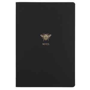 B5 SIZE NOTEBOOK BEE NOTES GOLD FOILED COVER DETAIL, CARDBOARD COVER COLOR BLACK INTERIOR DOTTED OR RULED, ROUNDED CORNERS, VISIBLE SINGER STITCHING ON THE SPINE, INTERIOR PAPER IVORY-COLORED 90 GMS, ACID FREE PAPER MADE IN COLOMBIA BY MAKE2D