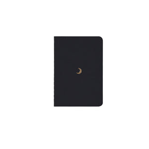 B7 MINI POCKET SIZE NOTEBOOK MOON GOLD FOILED COVER DETAIL, CARDBOARD COVER COLOR BLACK, INTERIOR DOTTED, ROUNDED CORNERS, VISIBLE SINGER STITCHING ON THE SPINE, INTERIOR PAPER IVORY-COLORED 90 GMS, ACID FREE PAPER MADE IN COLOMBIA BY MAKE2D