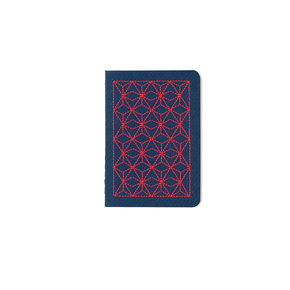 B7 MINI POCKET SIZE NOTEBOOK RED EMBROIDERED COVER DETAIL, CARDBOARD COVER COLOR BLUE, INTERIOR DOTTED, ROUNDED CORNERS, VISIBLE SINGER STITCHING ON THE SPINE, INTERIOR PAPER IVORY-COLORED 90 GMS, ACID FREE PAPER BY MAKE2D