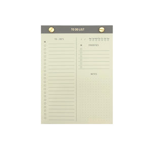 TO-DO LIST NOTEPAD GOLD FOILED COVER DETAIL, CARDBOARD COVER COLOR GREY, TO-DO’S PRIORITIES NOTES INTERIOR PAPER IVORY-COLORED 90 GMS, ACID FREE PAPER, GOLD SCREWS WITH PRE-PERFORATED DETACHABLE SHEETS MADE IN COLOMBIA BY MAKE2D