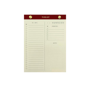TO-DO LIST NOTEPAD GOLD FOILED COVER DETAIL, CARDBOARD COVER COLOR RED, TO-DO’S PRIORITIES NOTES INTERIOR PAPER IVORY-COLORED 90 GMS, ACID FREE PAPER, GOLD SCREWS WITH PRE-PERFORATED DETACHABLE SHEETS MADE IN COLOMBIA BY MAKE2D